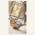 Montre femme rectangle au cadran doré avec chiffres romains, lunette sertie et bracelet acier bicolore